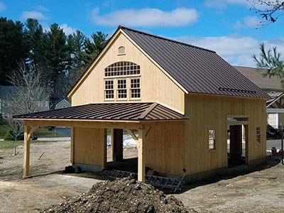 A new barn with a brown metal roof
