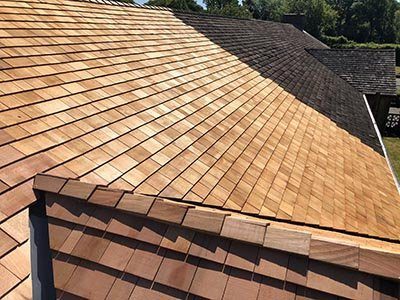 A cedar shake roof seen along the eave
