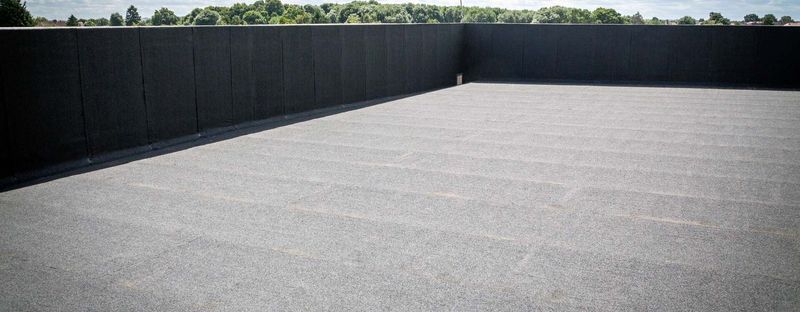 A commercial flat roof with a parapet wall