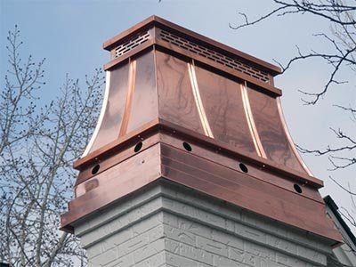 A tall copper chimney shroud