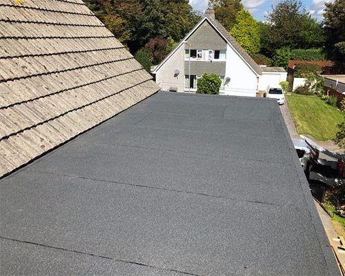 A flat roof between two pitched roofs