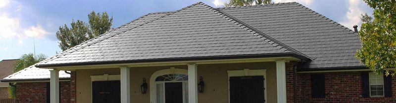 A house with a charcoal shingle roof