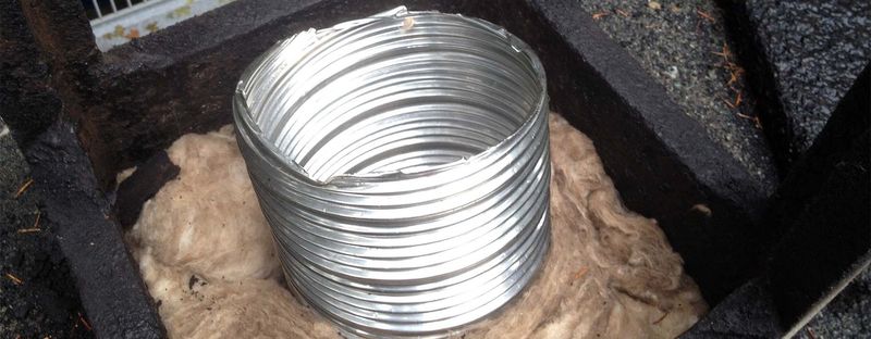 A stainless steel chimney liner going in