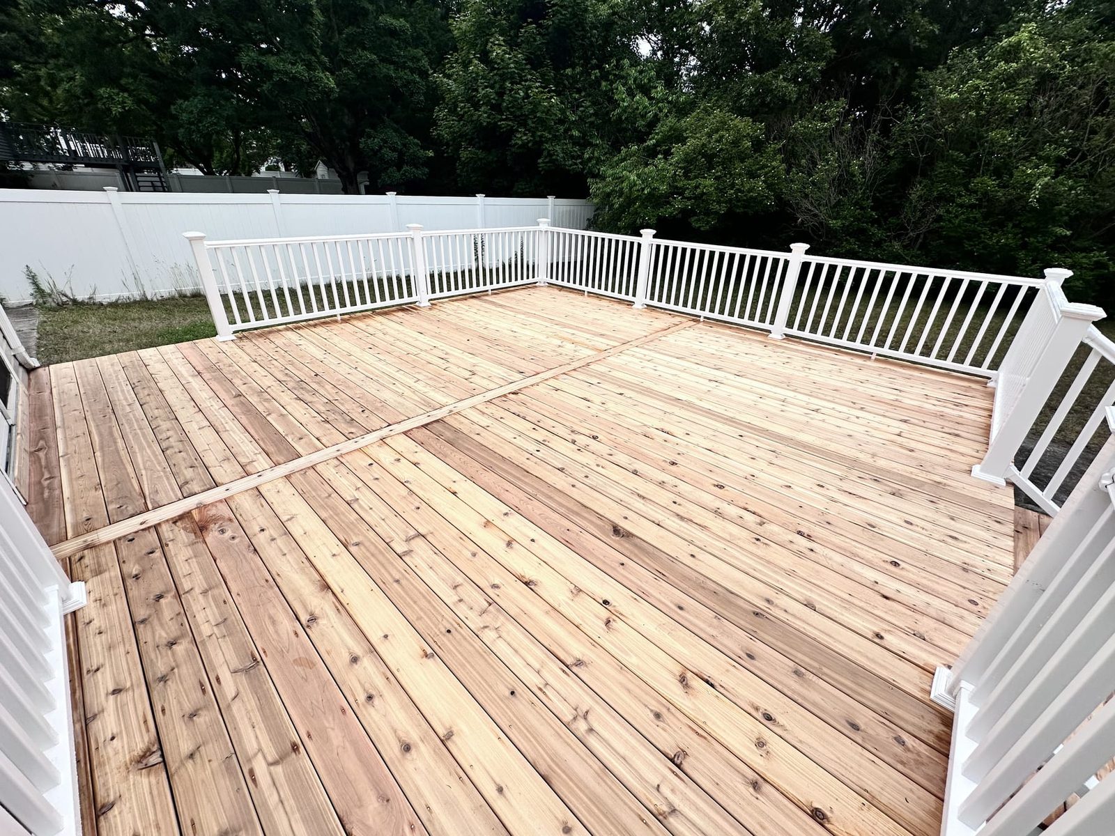A new cedar deck with white railings