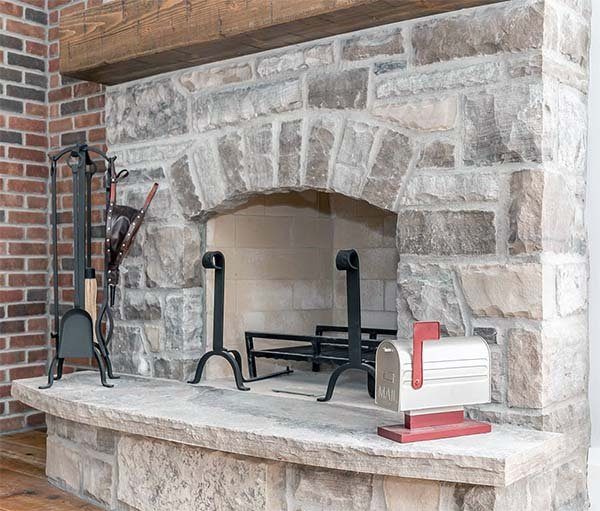 An outdoor stone fireplace