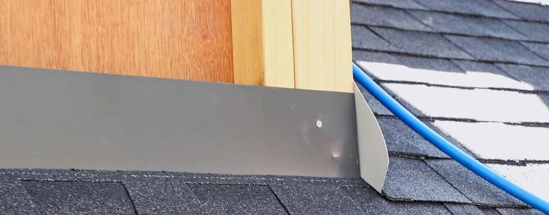 New step flashing where a shingle roof meets a wall