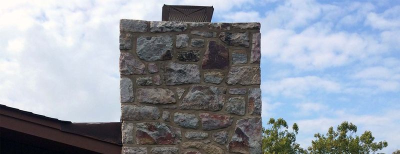 A stone chimney against the sky