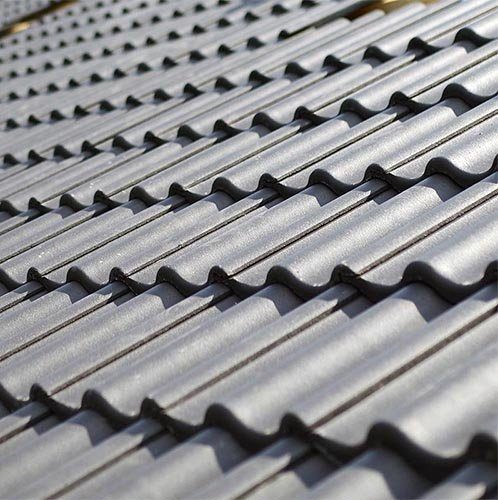 Grey tile-profile roofing panels, close up
